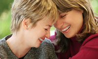 Two friends or lesbians share the trust of confidentiality